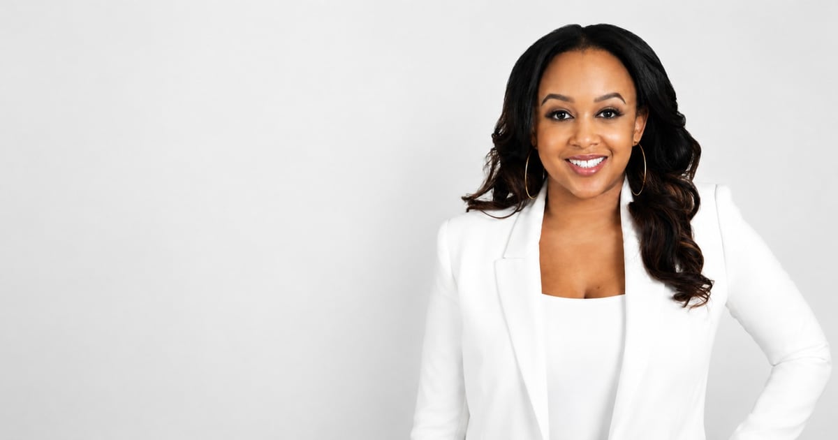 Toni Bullock, Emmy-winning producer, smiling in a white blazer